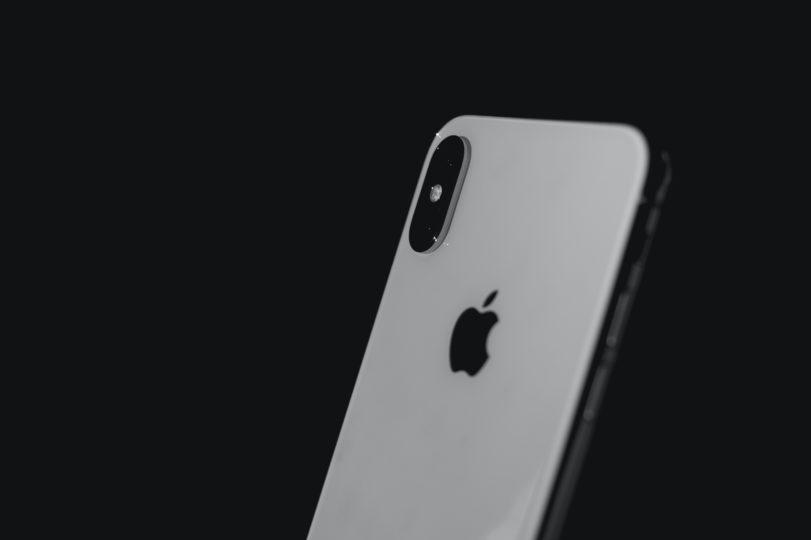 Image of grey Apple iPhone in a dark background