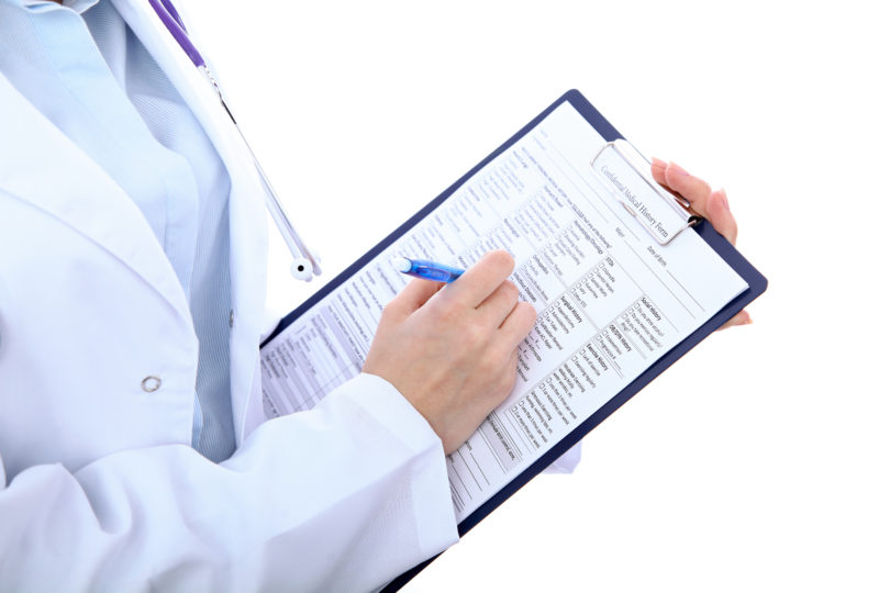 Doctor with a chart containing health data, protected under GDPR